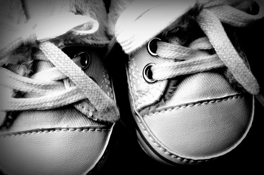 Black and white photo of baby shoes